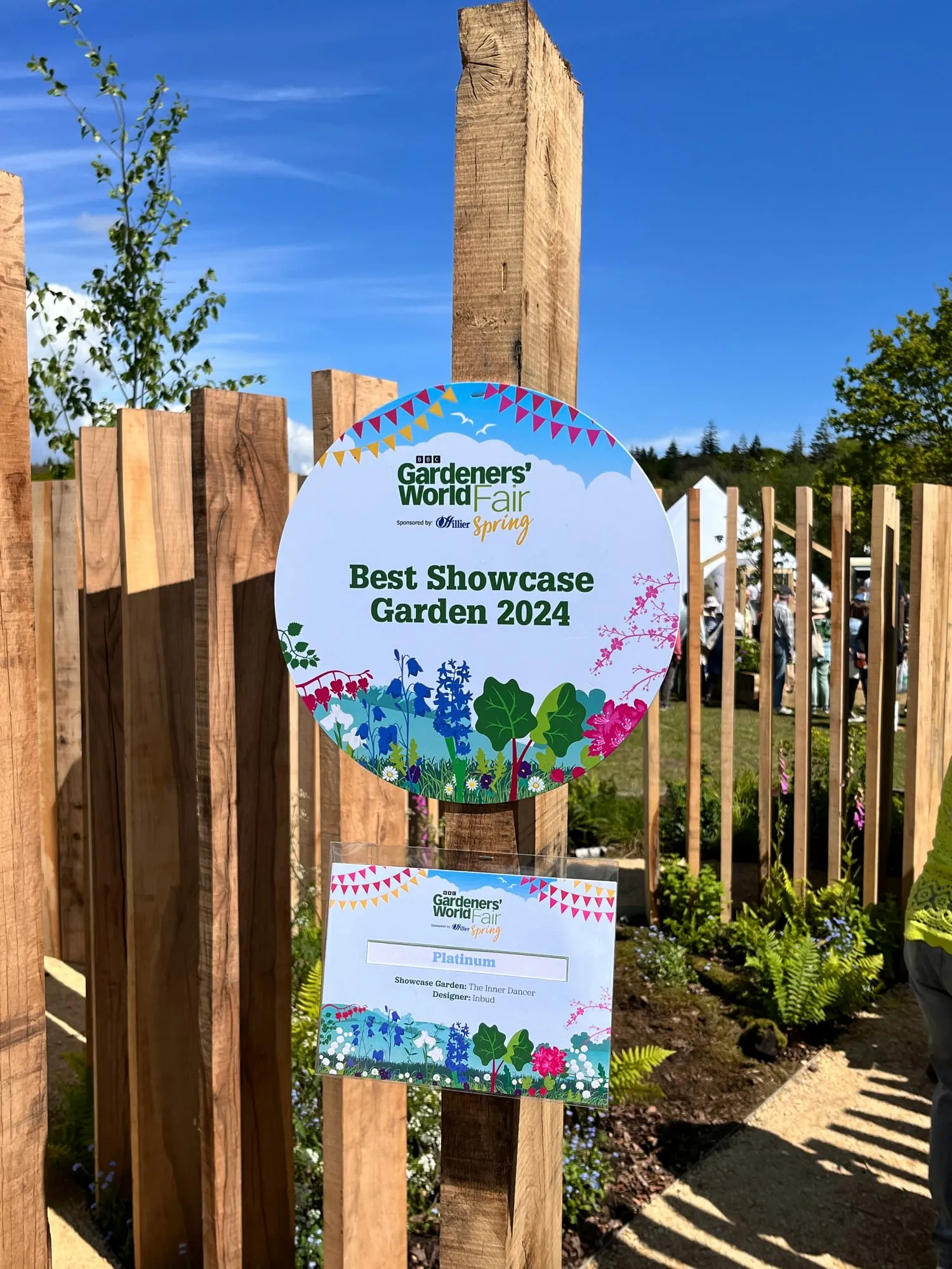 Best Showcase Garden 2024 award sign mounted on an oak post in the show garden